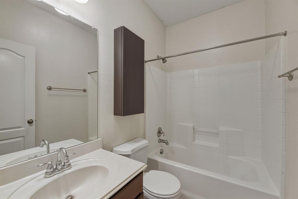 4027 Rome Court Irving, TX 75038 - Photo 26 of 33 a bathroom with a sink toilet and shower