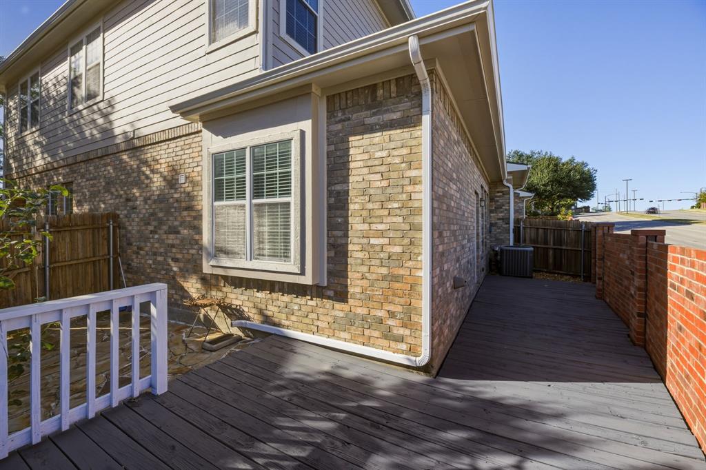 4027 Rome Court Irving, TX 75038 - Photo 30 of 33 a view of a deck with wooden floor and fence