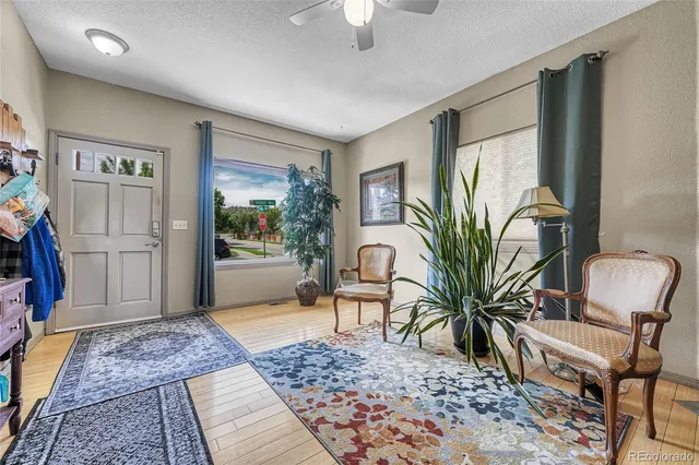 a living room with furniture and a rug