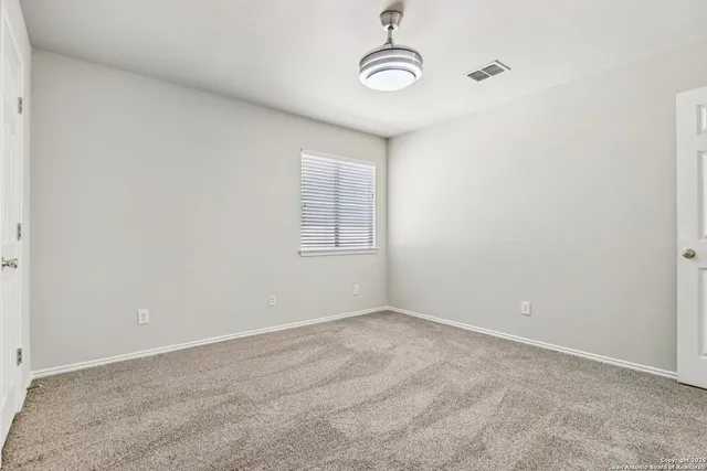a view of empty room with windows