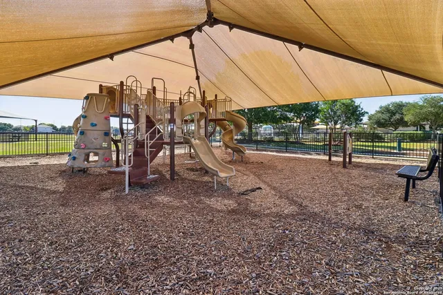 a view of a park with sitting area