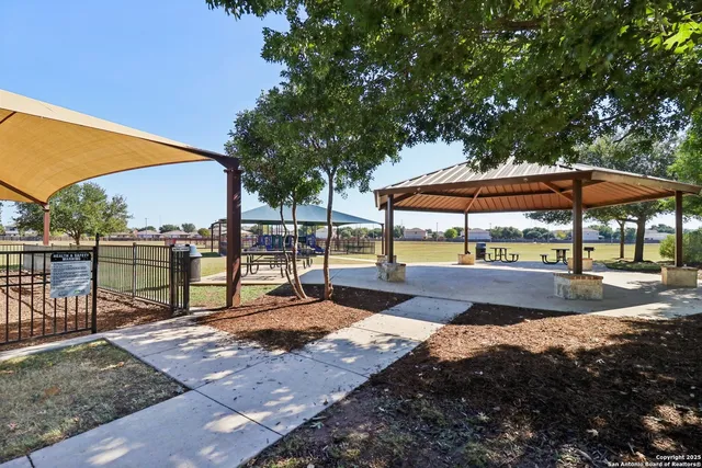 a view of swimming pool with sitting area and furniture