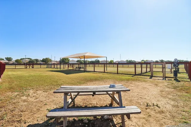 a view of swimming pool with outdoor seating