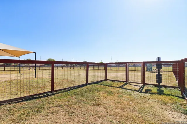a view of a swimming pool and a yard