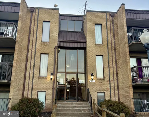 a front view of a house with many windows