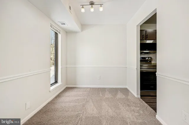 a kitchen with stainless steel appliances granite countertop a stove microwave and sink