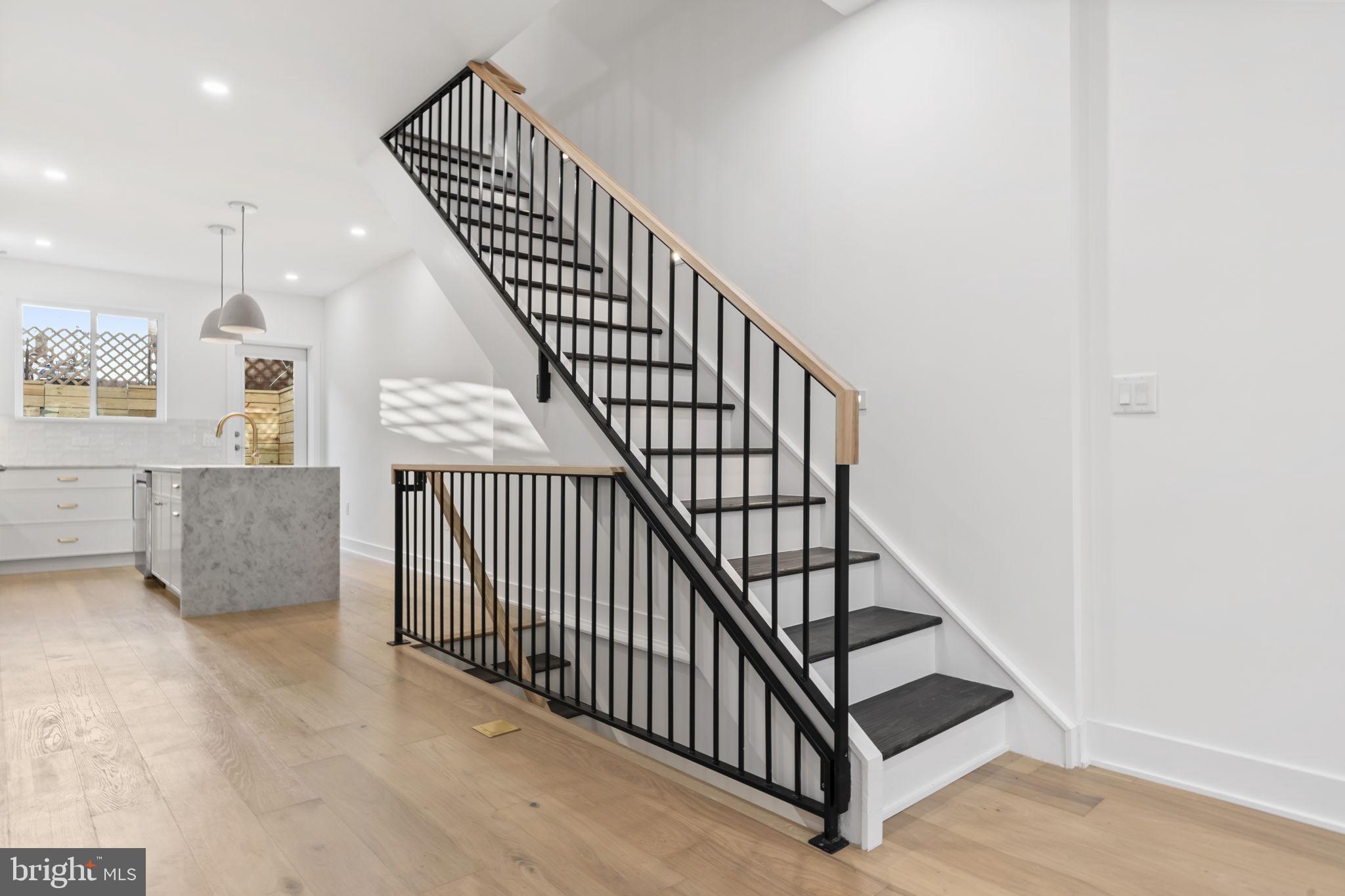 1318 South 8th Street Philadelphia, PA 19147 - Photo 14 of 47 a view of staircase with railing and white walls