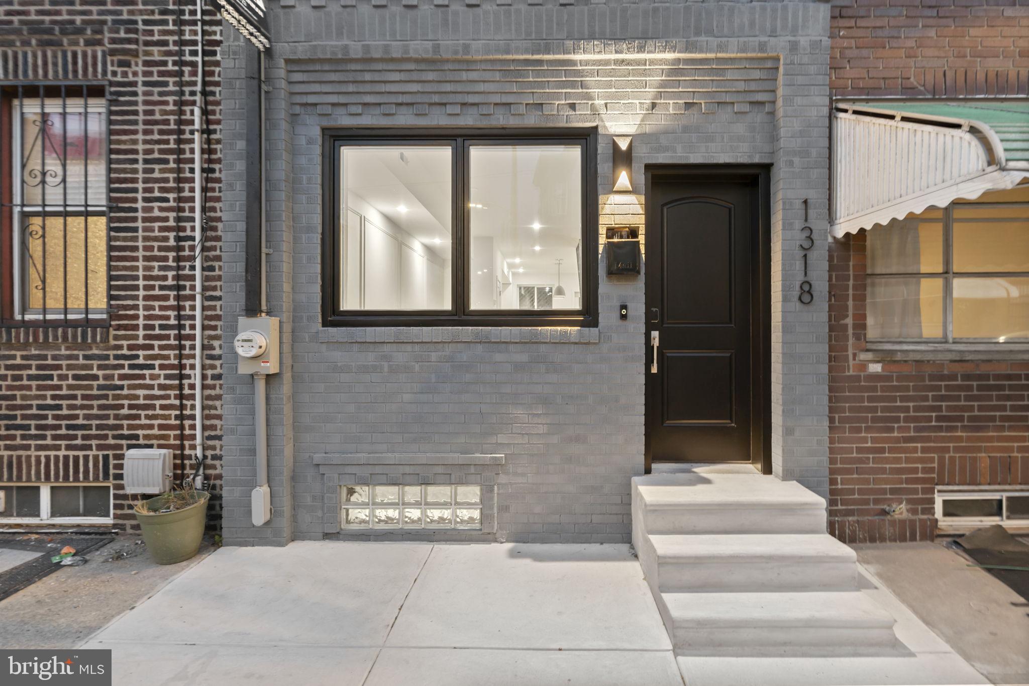 1318 South 8th Street Philadelphia, PA 19147 - Photo 2 of 47 a front view of a house with a