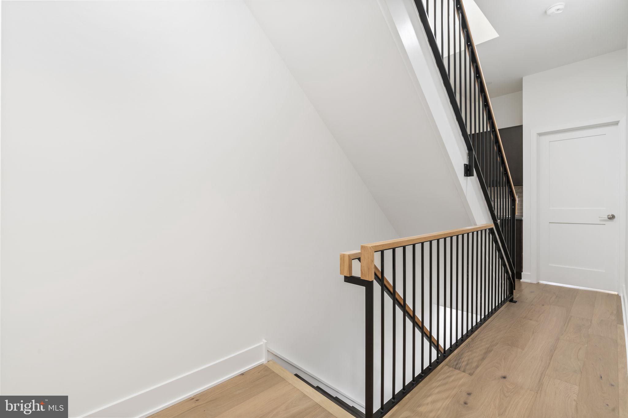 1318 South 8th Street Philadelphia, PA 19147 - Photo 23 of 47 a view of a hallway with stairs
