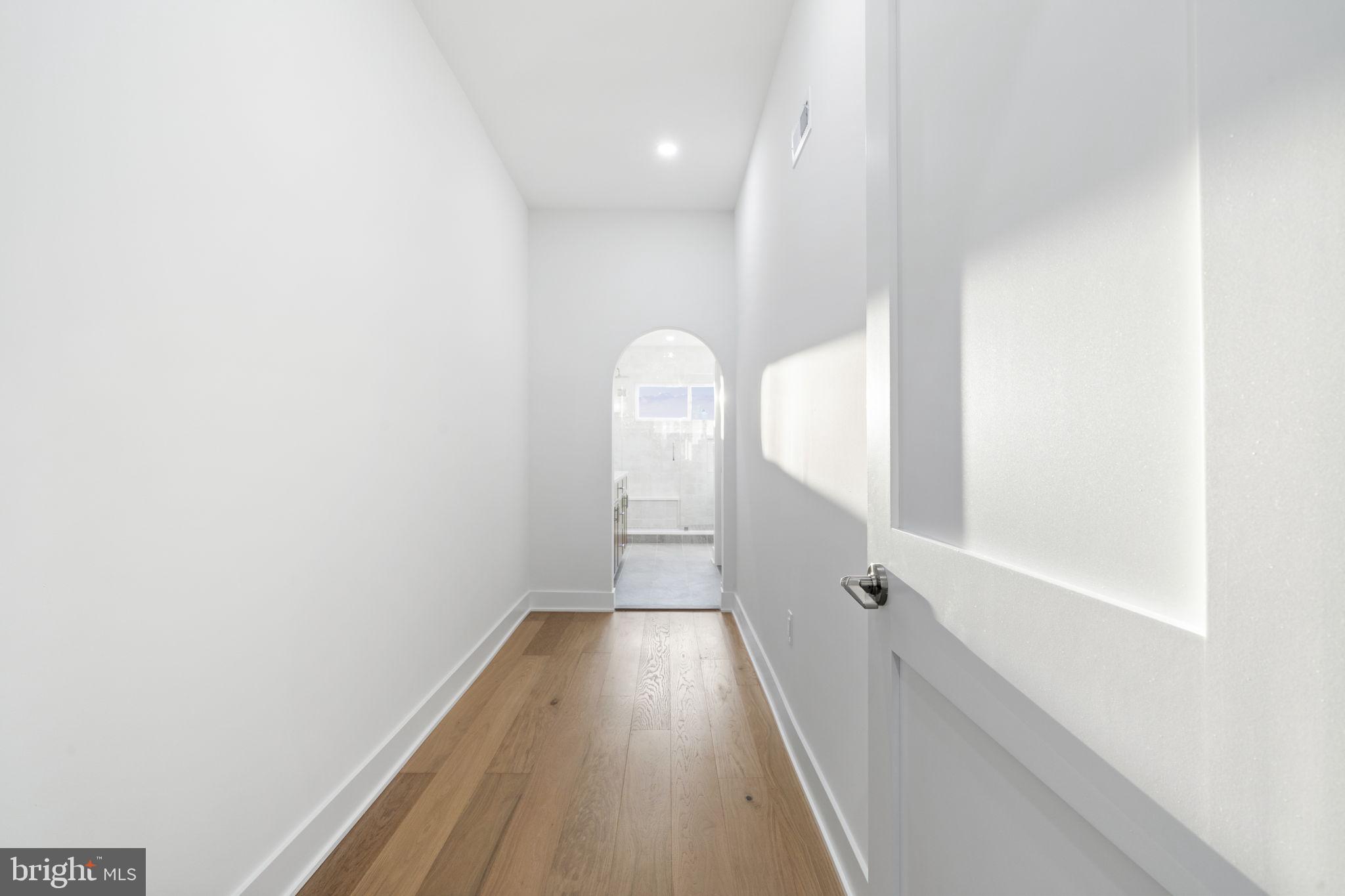 1318 South 8th Street Philadelphia, PA 19147 - Photo 25 of 47 a view of a hallway with wooden floor