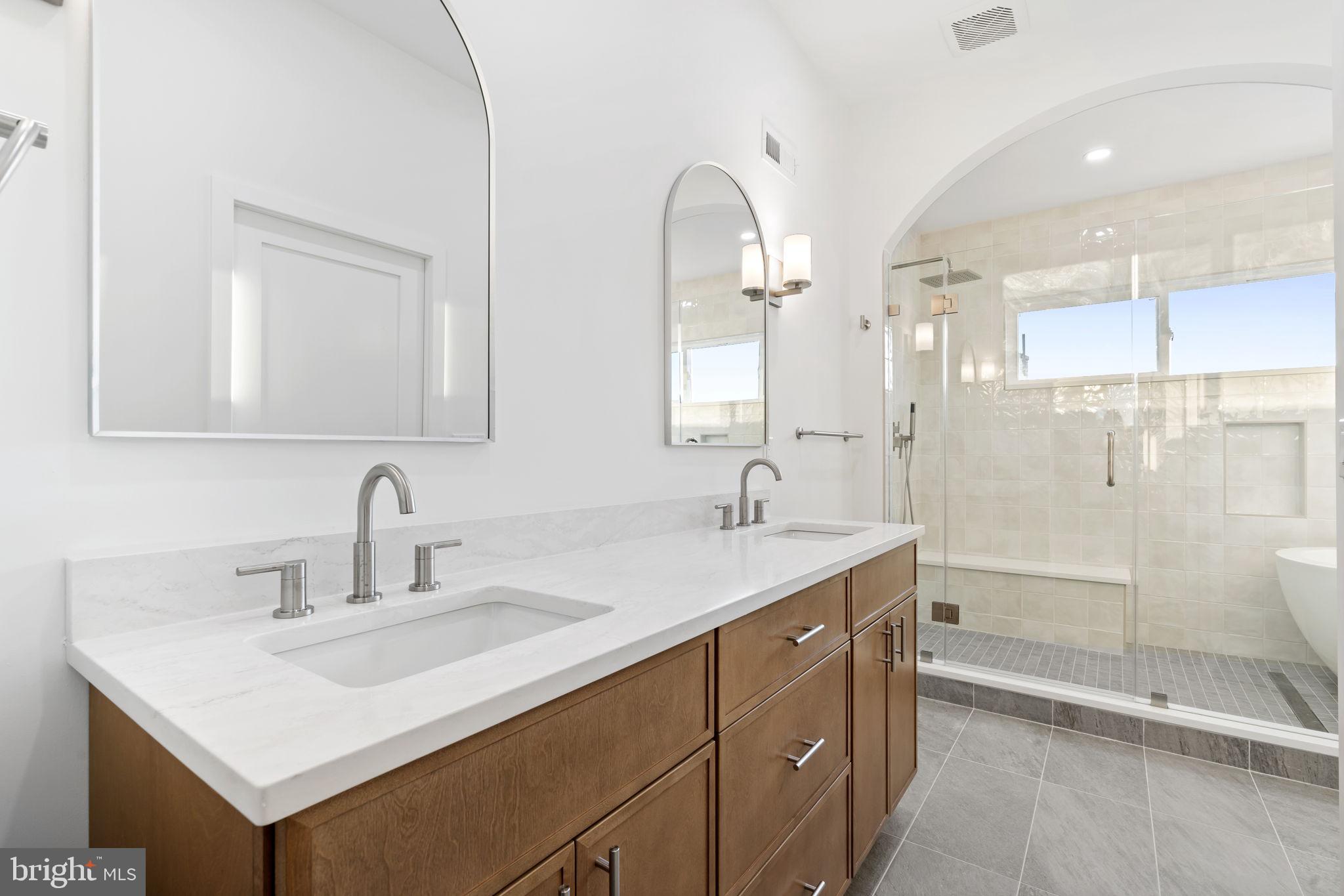 1318 South 8th Street Philadelphia, PA 19147 - Photo 30 of 47 a bathroom with a sink and a mirror