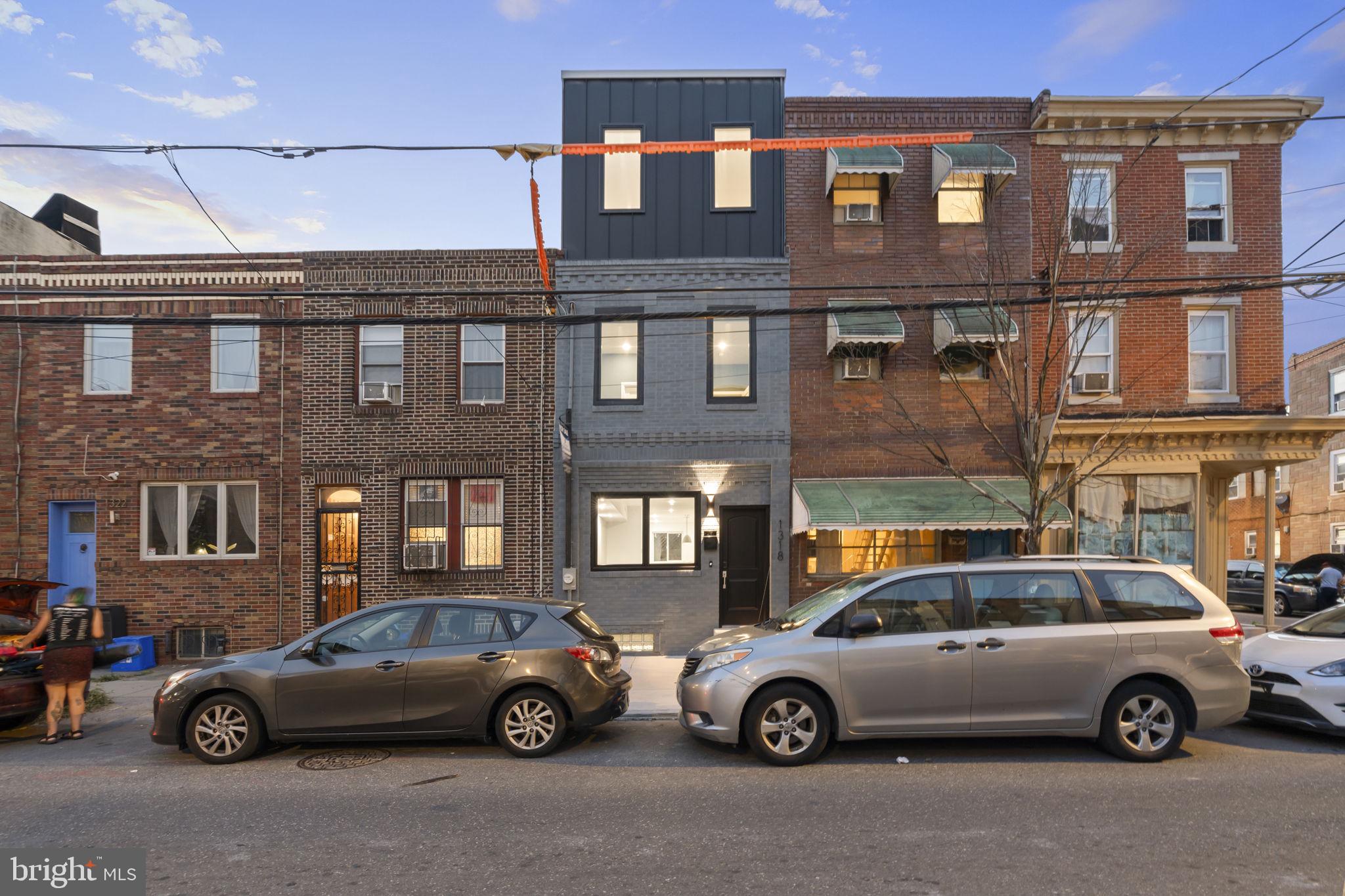1318 South 8th Street Philadelphia, PA 19147 - Photo 3 of 47 a front view of a house with parking space