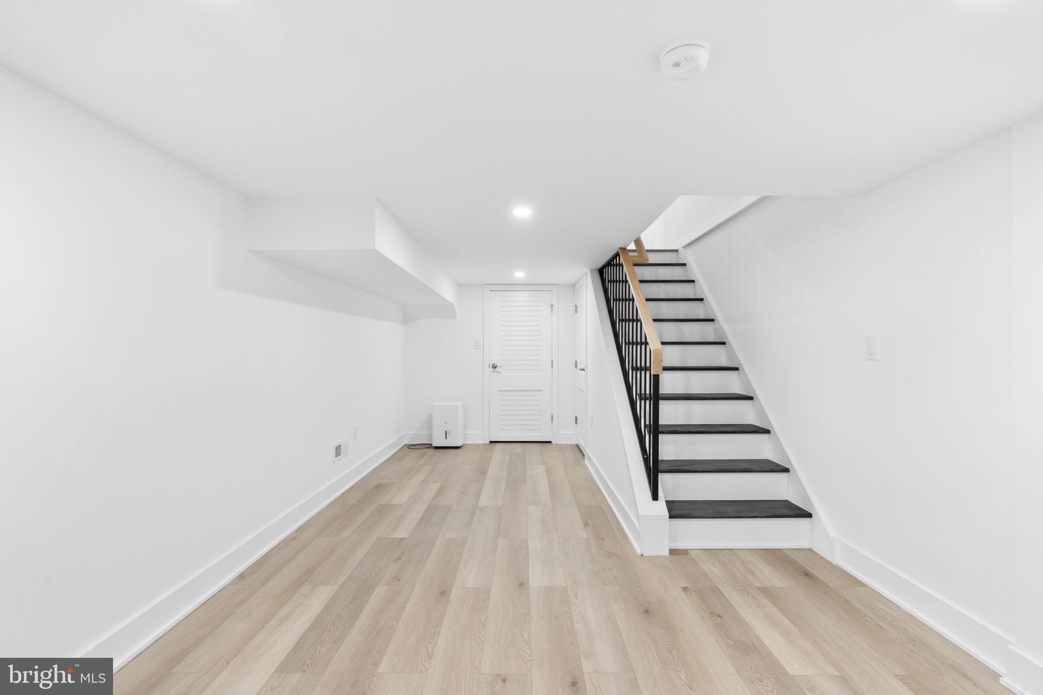 1318 South 8th Street Philadelphia, PA 19147 - Photo 40 of 47 a view of wooden floor and windows in a room