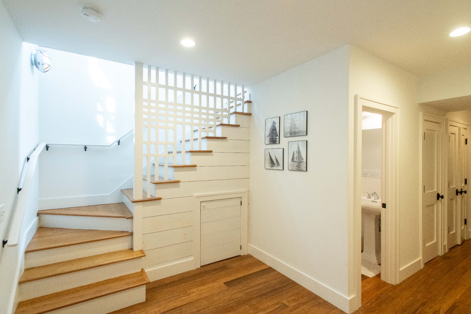 146 Surfside Road Nantucket, MA 02554 - Photo 32 of 43 a view of entryway with wooden floor and staircase