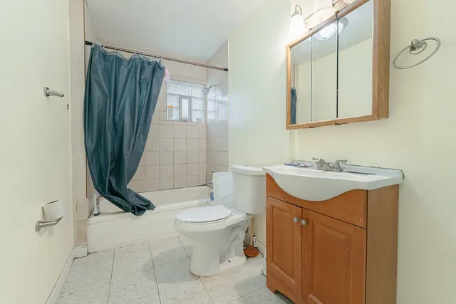 a bathroom with a sink a toilet and mirror