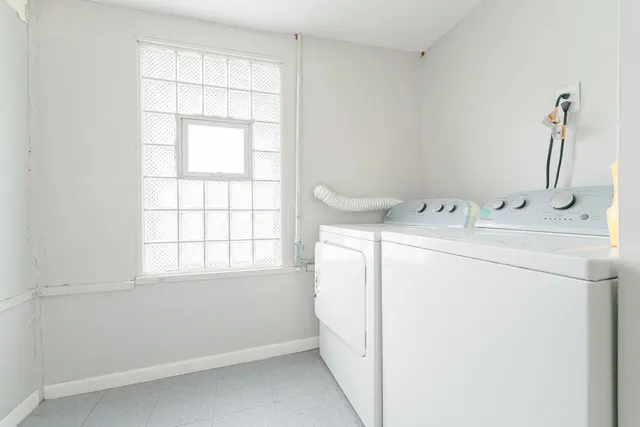 a utility room with dryer and washer