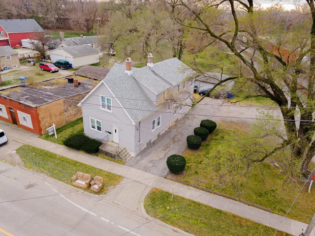 an aerial view of residential houses with outdoor space