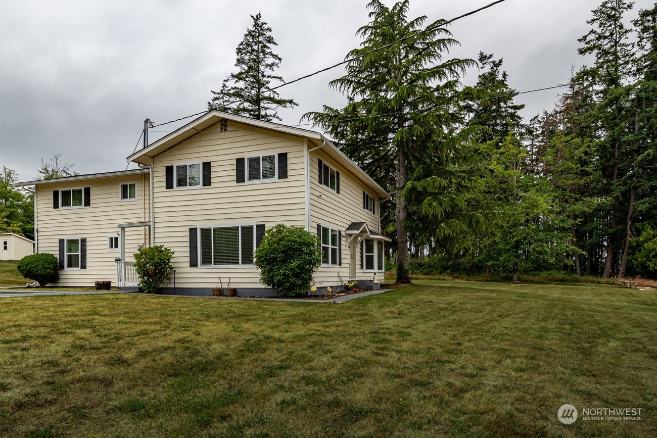 139 West Frostad Road Oak Harbor, WA 98277 - Photo 1 of 39 a front view of a house with a yard