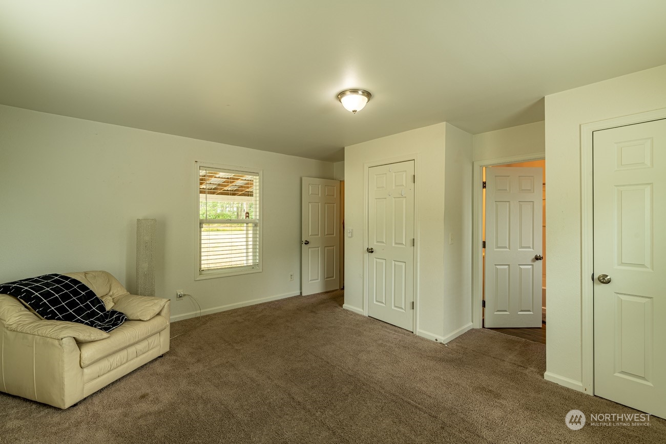 139 West Frostad Road Oak Harbor, WA 98277 - Photo 13 of 39 a spacious bedroom with a bed and a window