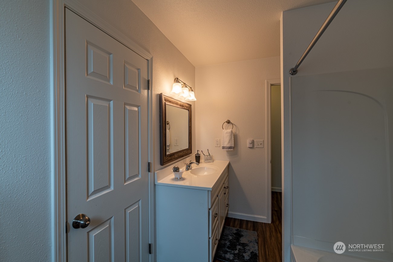 139 West Frostad Road Oak Harbor, WA 98277 - Photo 15 of 39 a bathroom with a sink a mirror and a toilet