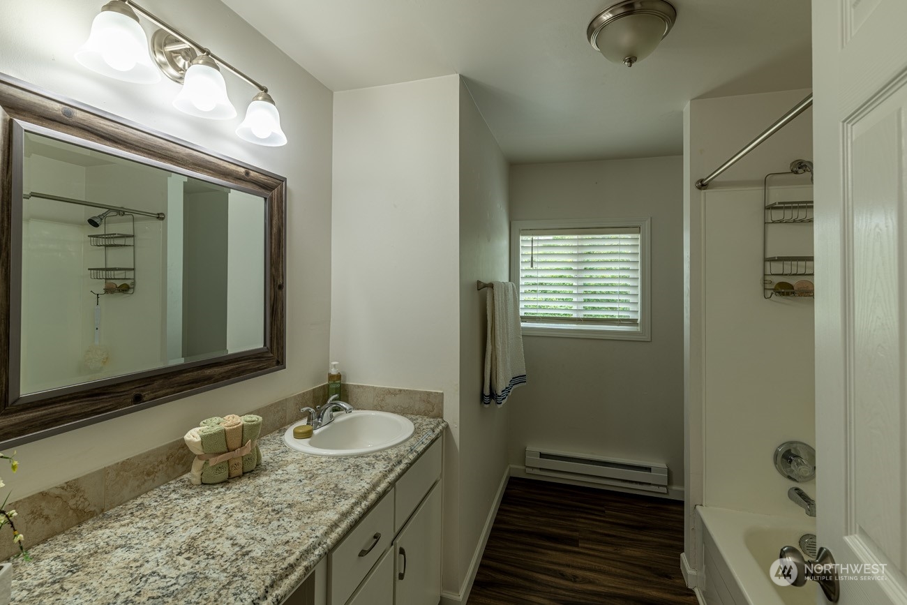 139 West Frostad Road Oak Harbor, WA 98277 - Photo 25 of 39 a bathroom with a granite countertop sink and a mirror