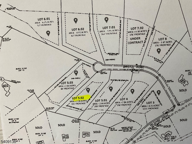 a view of a room with lots of windows