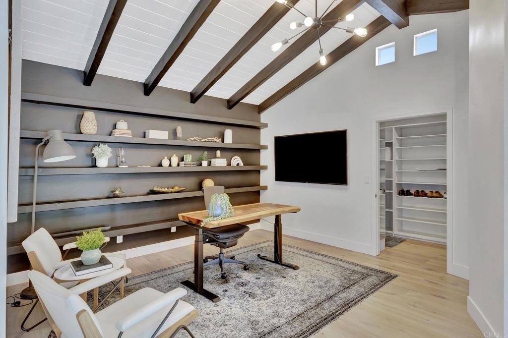 201 Sierra Ridge Drive Encinitas, CA 92024 - Photo 13 of 45 a living room with furniture and a flat screen tv