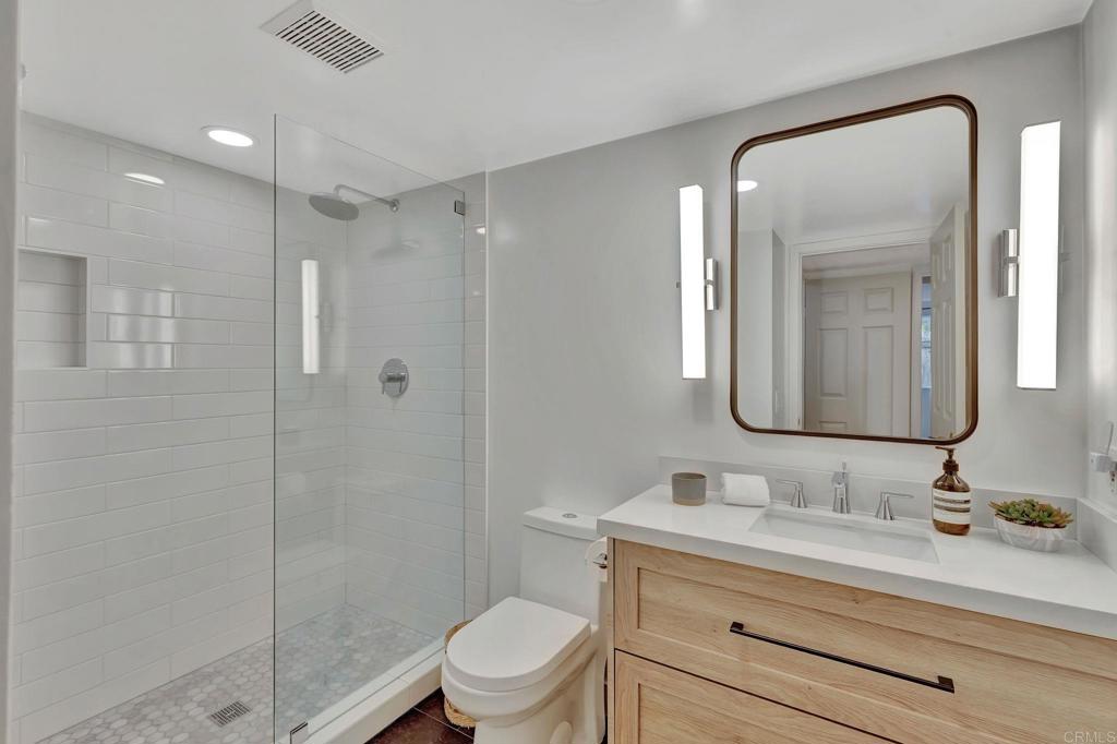201 Sierra Ridge Drive Encinitas, CA 92024 - Photo 18 of 45 a bathroom with a sink a toilet and shower