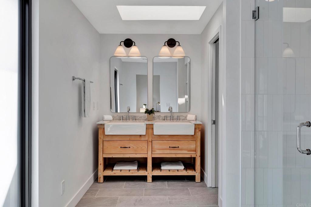 201 Sierra Ridge Drive Encinitas, CA 92024 - Photo 21 of 45 a room with two baby crib and dresser