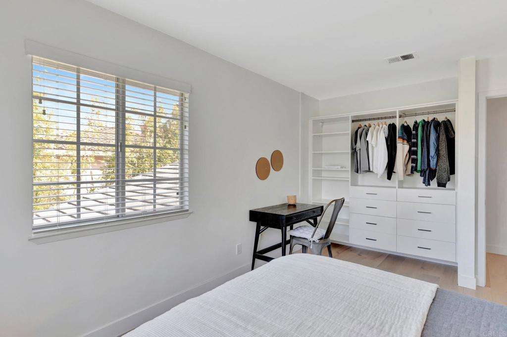 201 Sierra Ridge Drive Encinitas, CA 92024 - Photo 24 of 45 a bedroom with a bed and a window