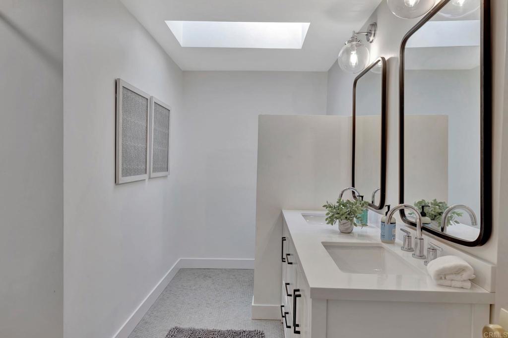 201 Sierra Ridge Drive Encinitas, CA 92024 - Photo 27 of 45 a bathroom with a sink and a mirror