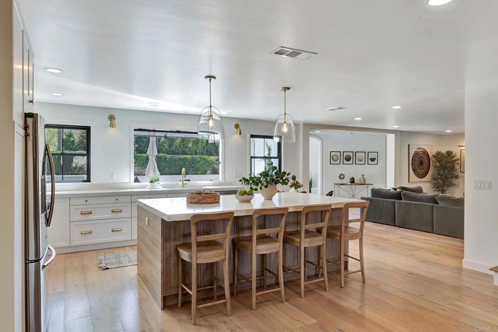 201 Sierra Ridge Drive Encinitas, CA 92024 - Photo 3 of 45 a view of a dining room with furniture window and wooden floor