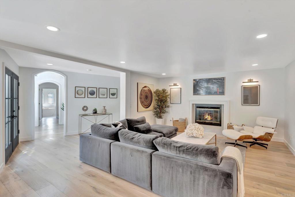 201 Sierra Ridge Drive Encinitas, CA 92024 - Photo 6 of 45 a living room with furniture and a fireplace