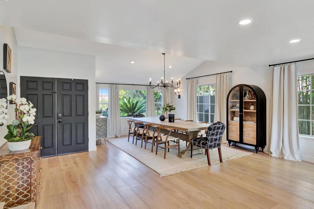 201 Sierra Ridge Drive Encinitas, CA 92024 - Photo 10 of 45 a view of a dining room with furniture and chandelier