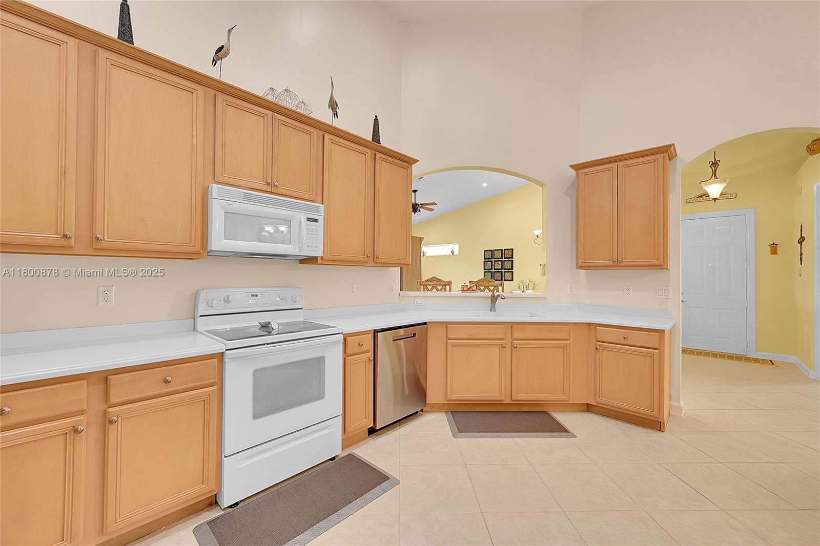 23157 Addison Lakes Circle Boca Raton, FL 33433 - Photo 11 of 30 a kitchen with stainless steel appliances granite countertop a sink and cabinets