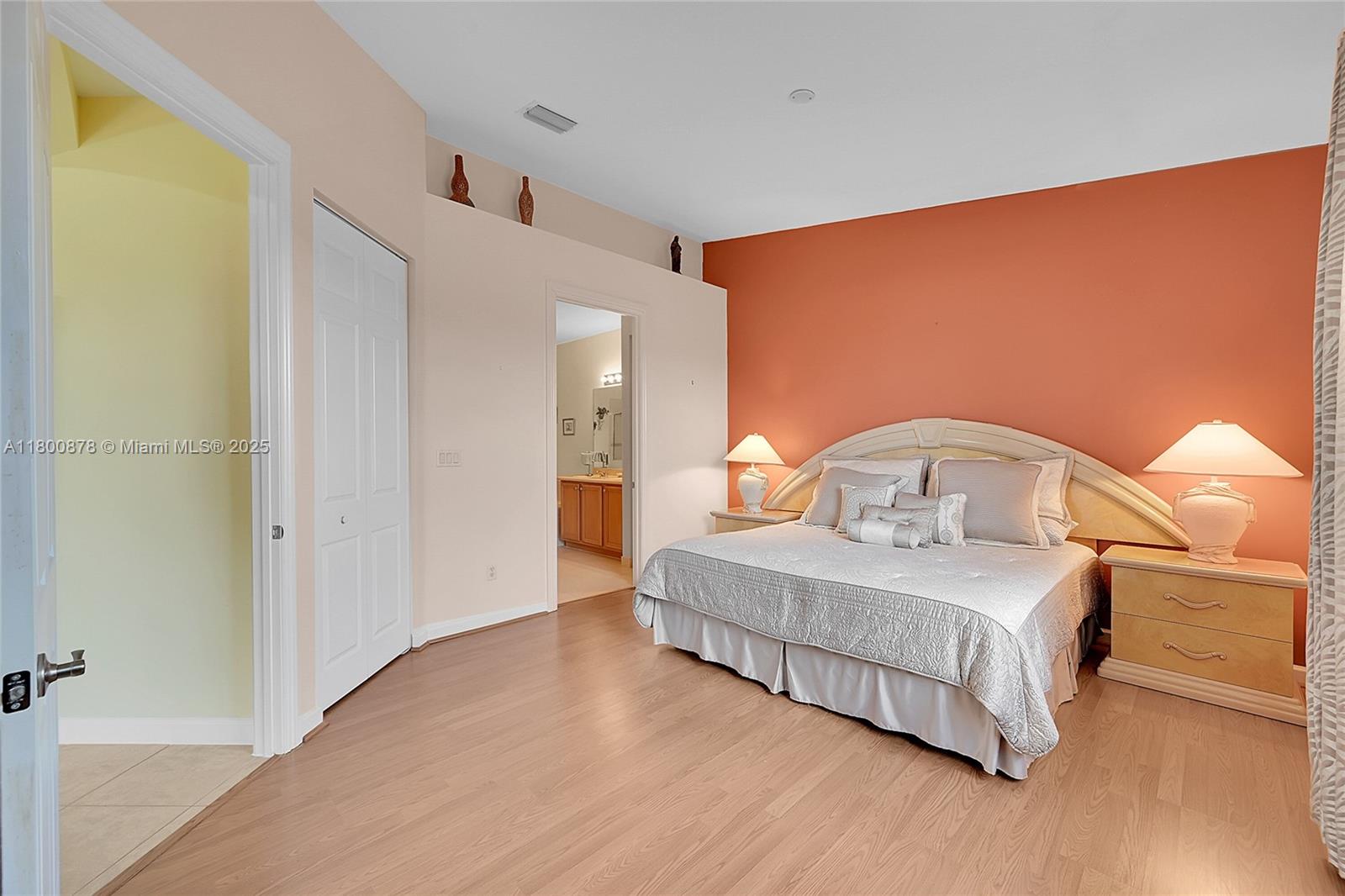 23157 Addison Lakes Circle Boca Raton, FL 33433 - Photo 13 of 30 a spacious bedroom with a bed and a table