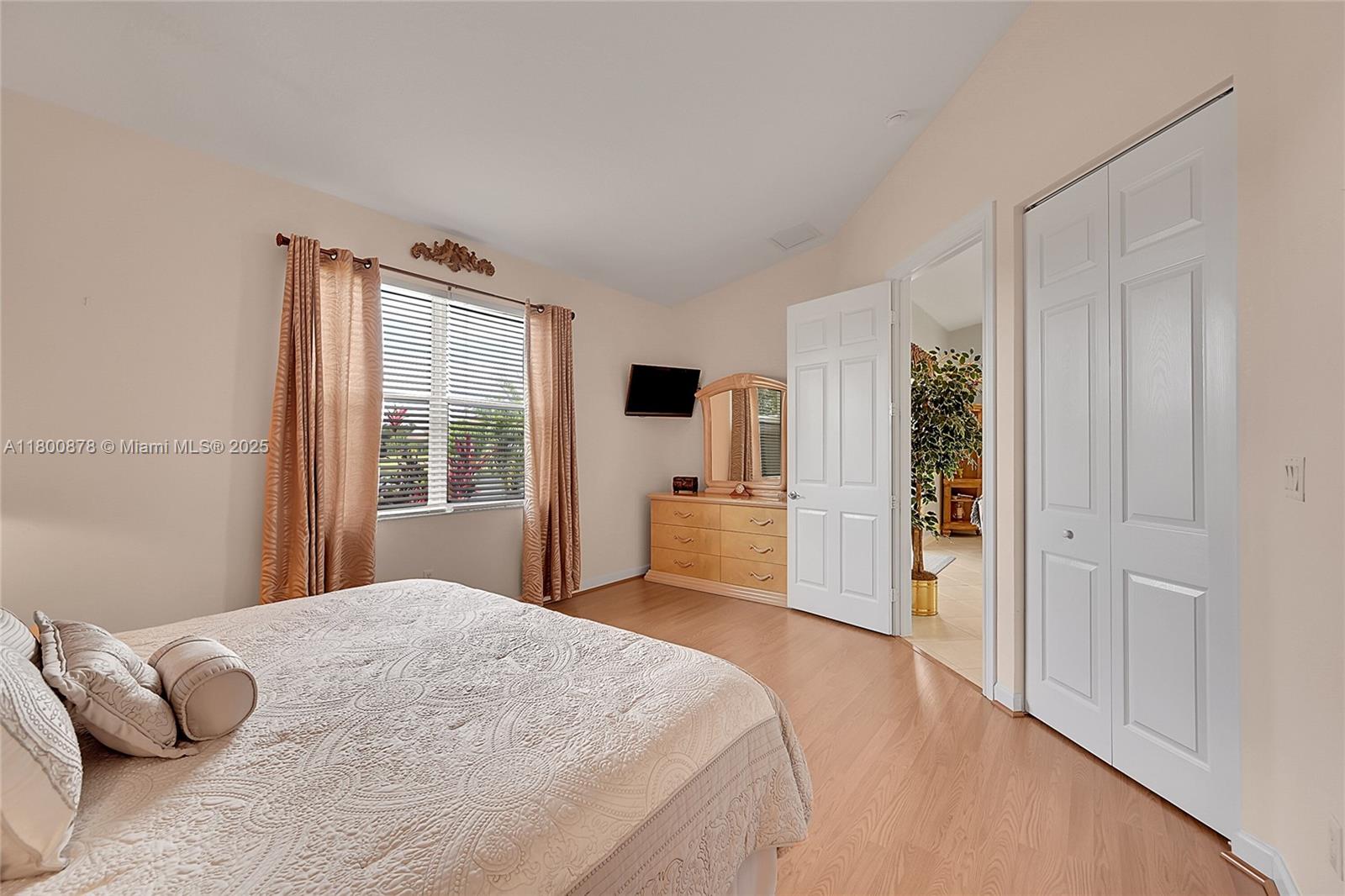 23157 Addison Lakes Circle Boca Raton, FL 33433 - Photo 15 of 30 a bedroom with a bed and flat screen tv