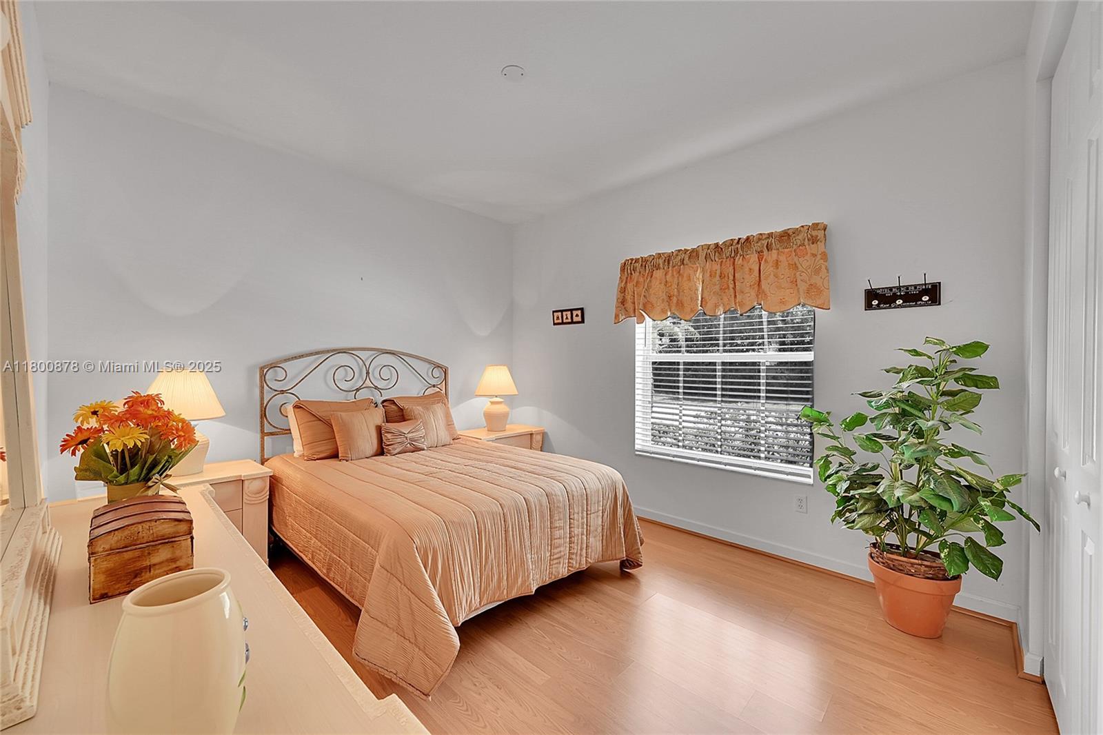 23157 Addison Lakes Circle Boca Raton, FL 33433 - Photo 21 of 30 a bedroom with a bed and a potted plant