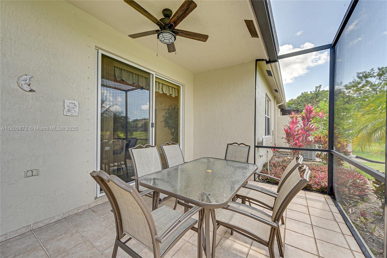 23157 Addison Lakes Circle Boca Raton, FL 33433 - Photo 24 of 30 a dining room with furniture and a floor to ceiling window
