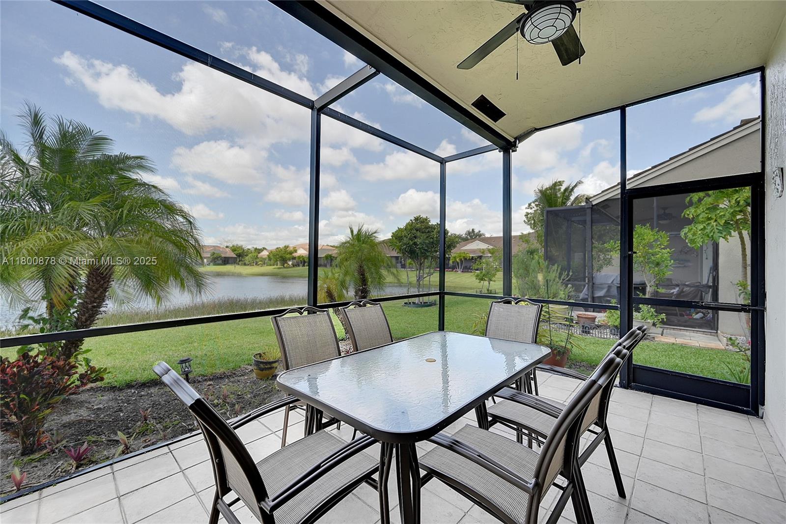 23157 Addison Lakes Circle Boca Raton, FL 33433 - Photo 25 of 30 a view of a patio with a table chairs and a table