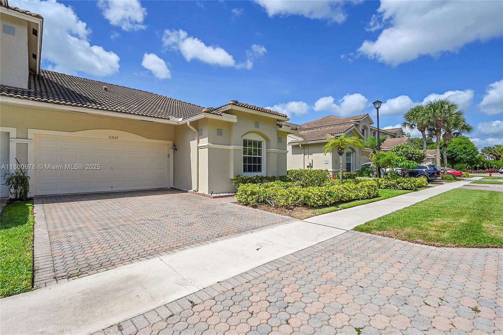 23157 Addison Lakes Circle Boca Raton, FL 33433 - Photo 3 of 30 a front view of a house with a yard