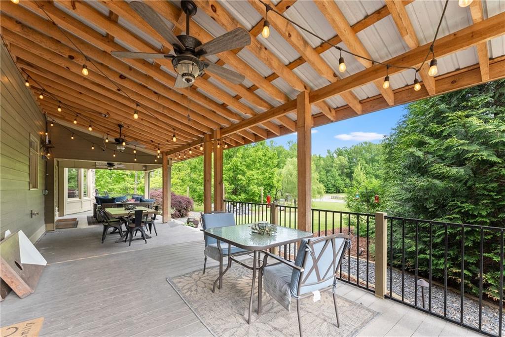 253 Happy Trails Way Jasper, GA 30143 - Photo 72 of 97 a view of a patio with table and chairs and potted plants