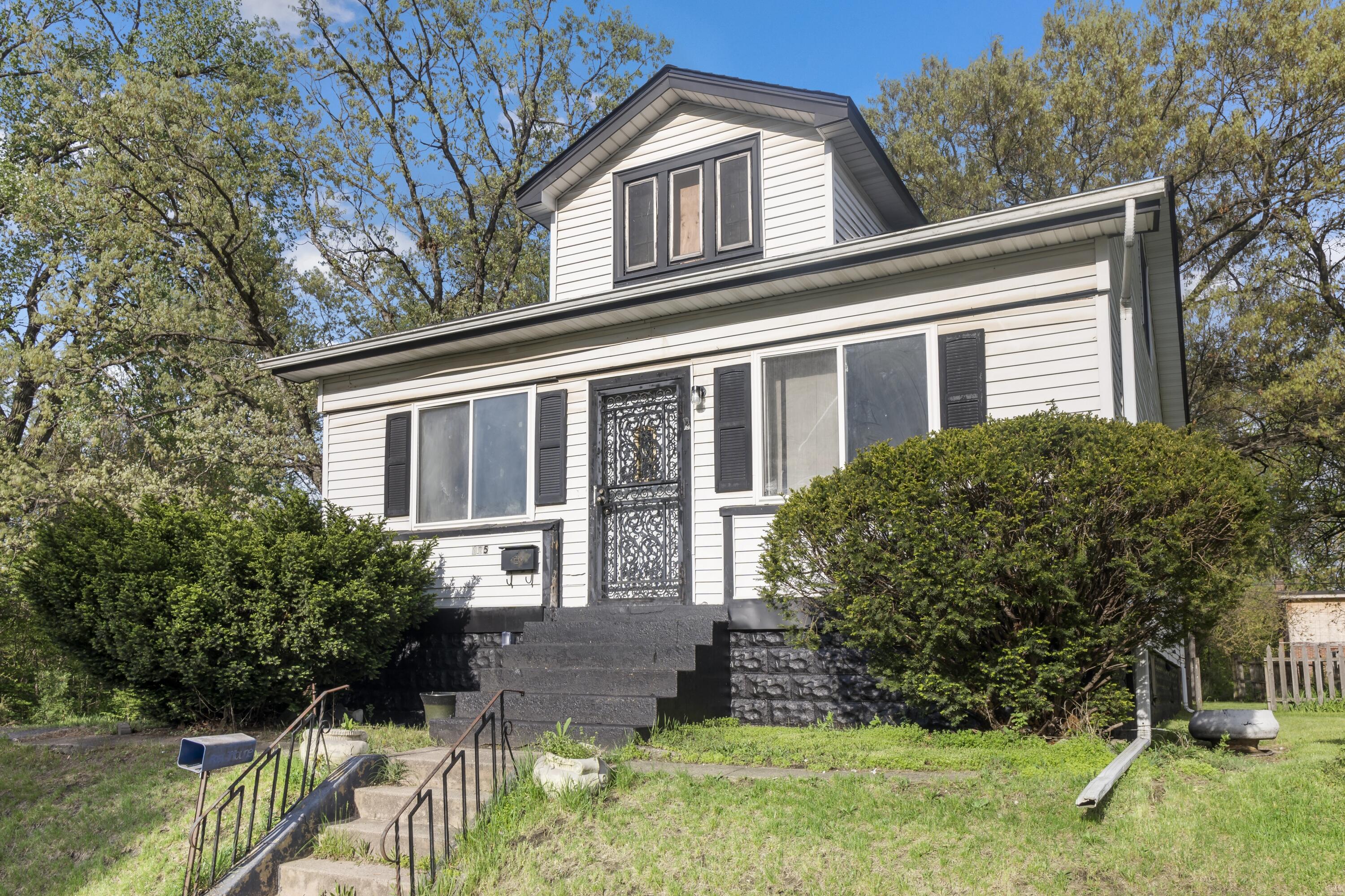 a house view with a garden space