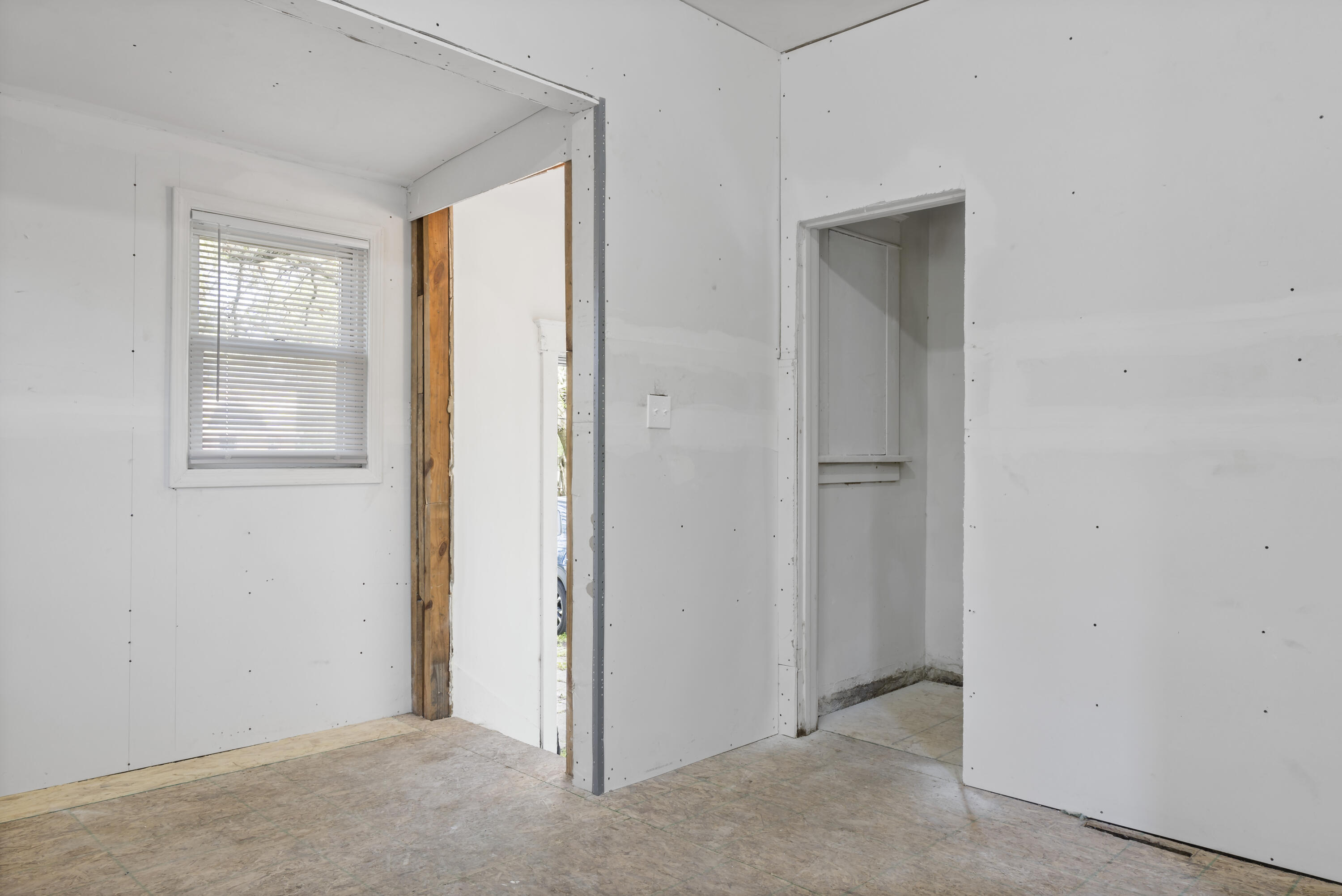 605 Mount Street Gary, IN 46406 - Photo 4 of 23 a view of an empty room with windows and closet