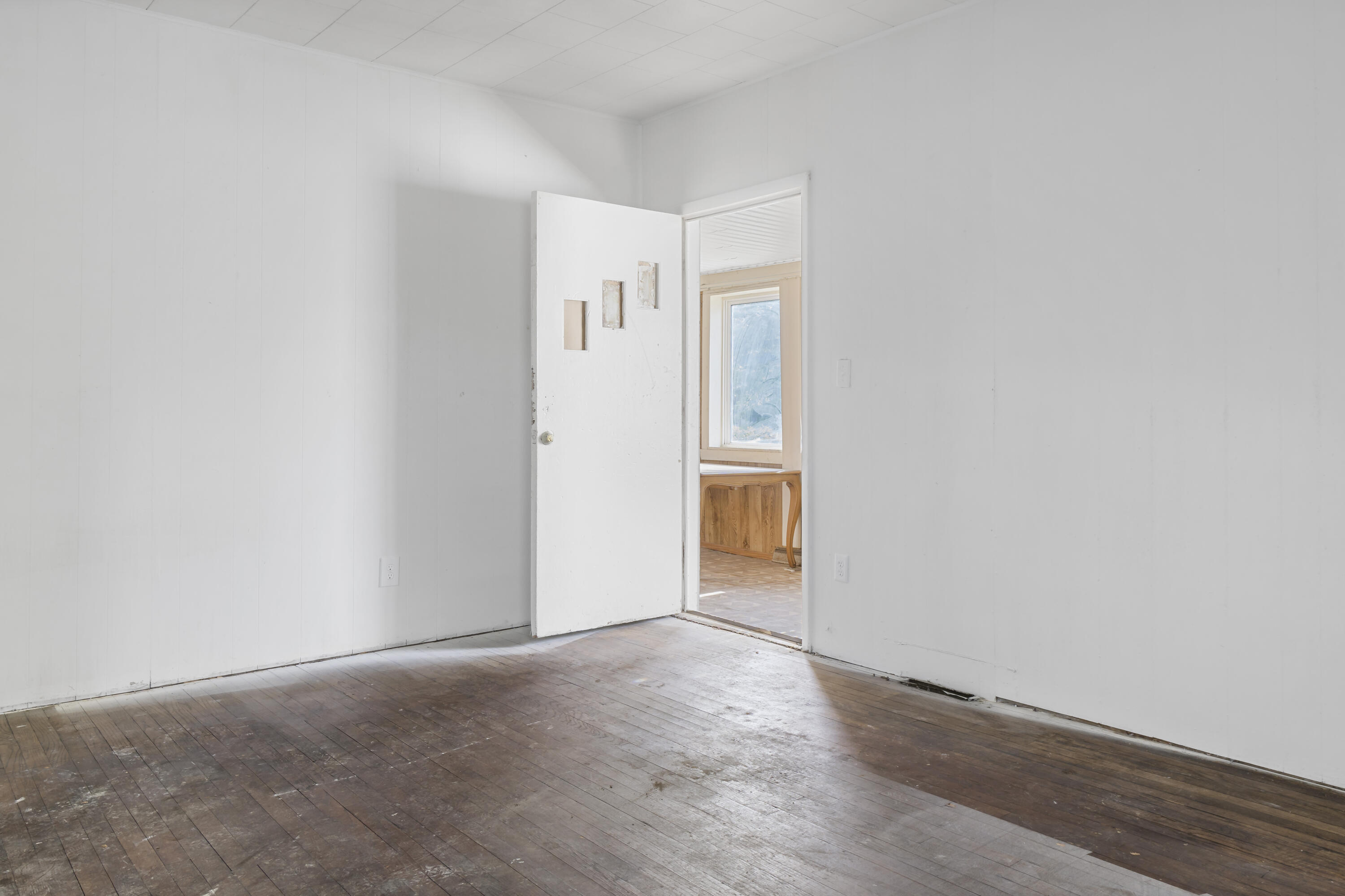 605 Mount Street Gary, IN 46406 - Photo 7 of 23 a view of an empty room and wooden floor