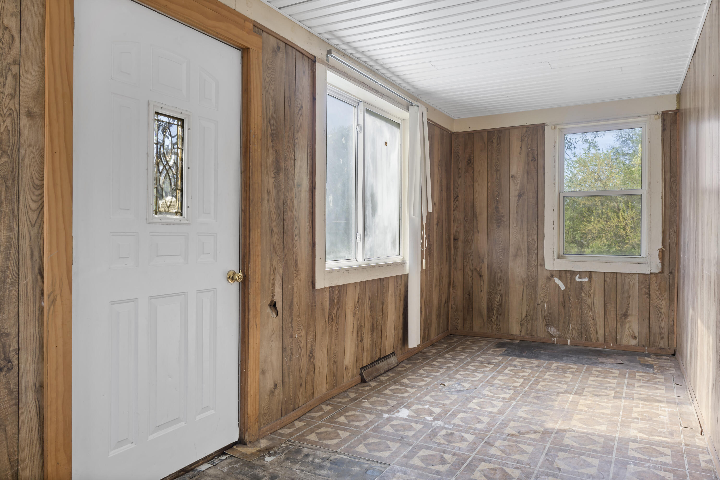 605 Mount Street Gary, IN 46406 - Photo 8 of 23 a view of an empty room with a window