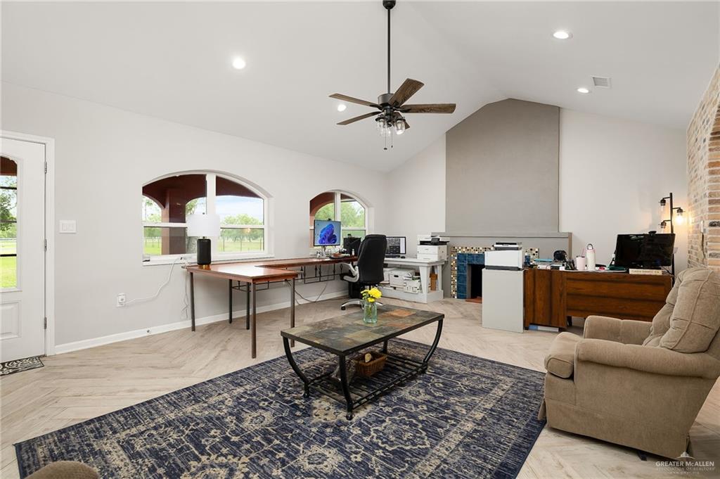 22172 North Olmito Road Rio Hondo, TX 78583 - Photo 6 of 33 a living room with furniture and a rug