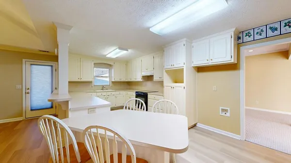 a view of a kitchen with marble kitchen and a fireplace