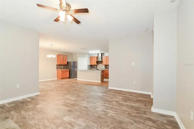 a view of a kitchen with a sink and cabinets