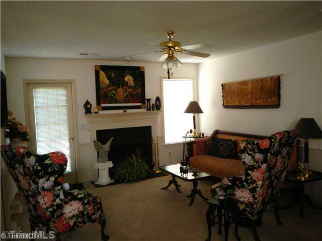 4103 Chilton Way High Point, NC 27265 - Photo 14 of 14 Living Room. Open floor plan with living room, dining room and kitchen together.